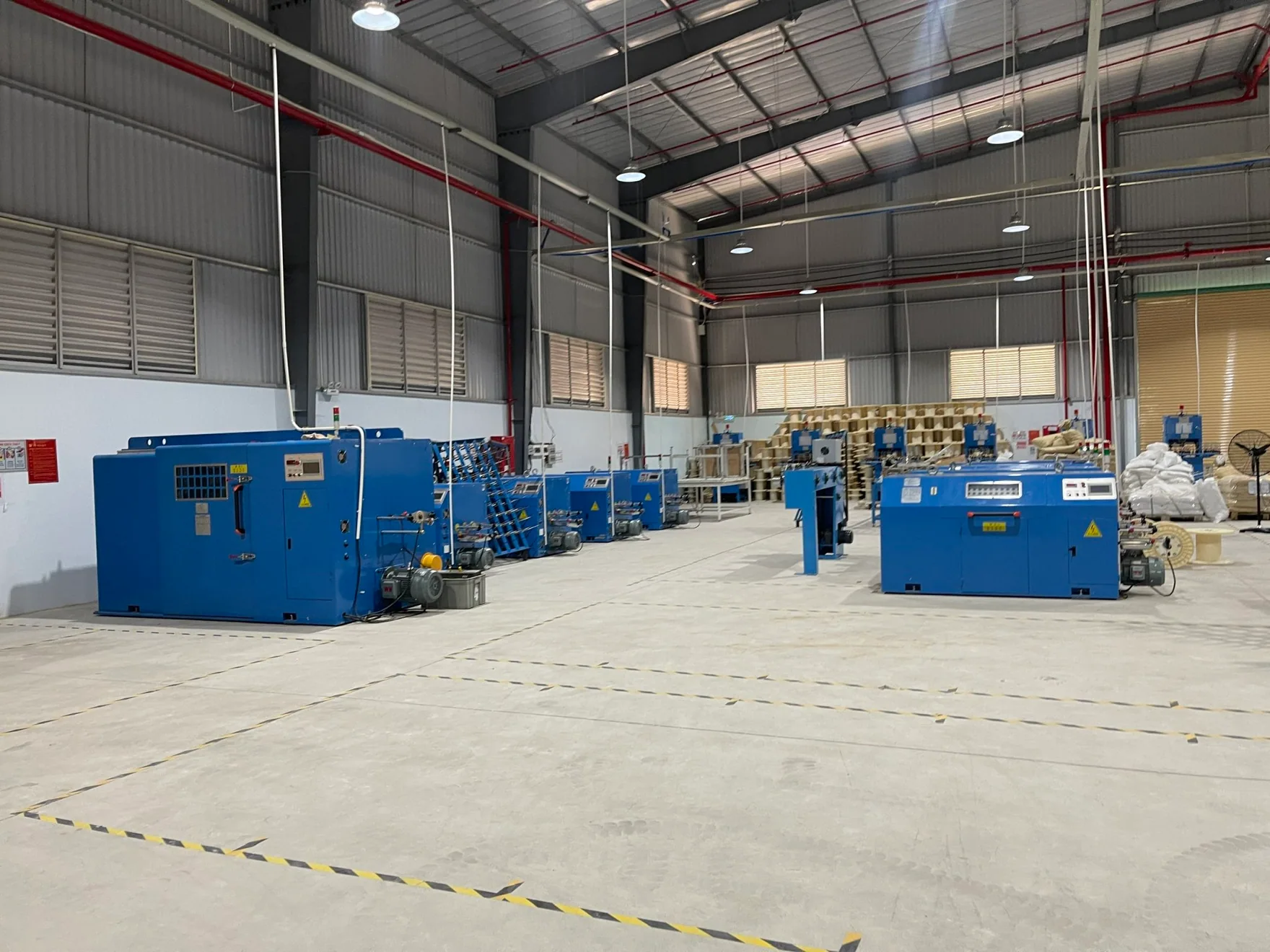 Cable production equipment arranged across the MEIGUAN workshop in Vietnam.